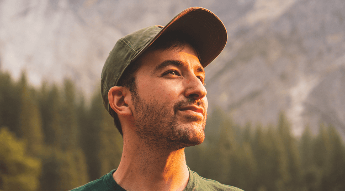 man wearing hat in nature