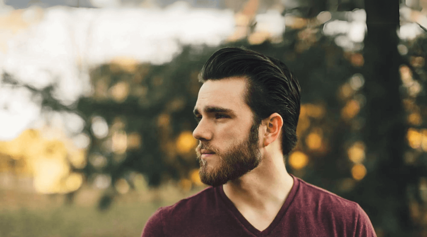 man with beard looking off into the distance