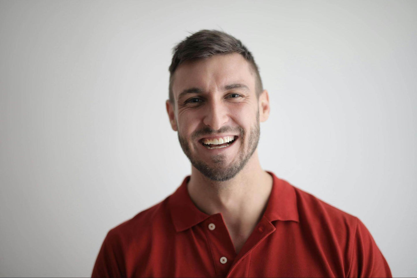 Man in Red Button Up Shirt Smiling