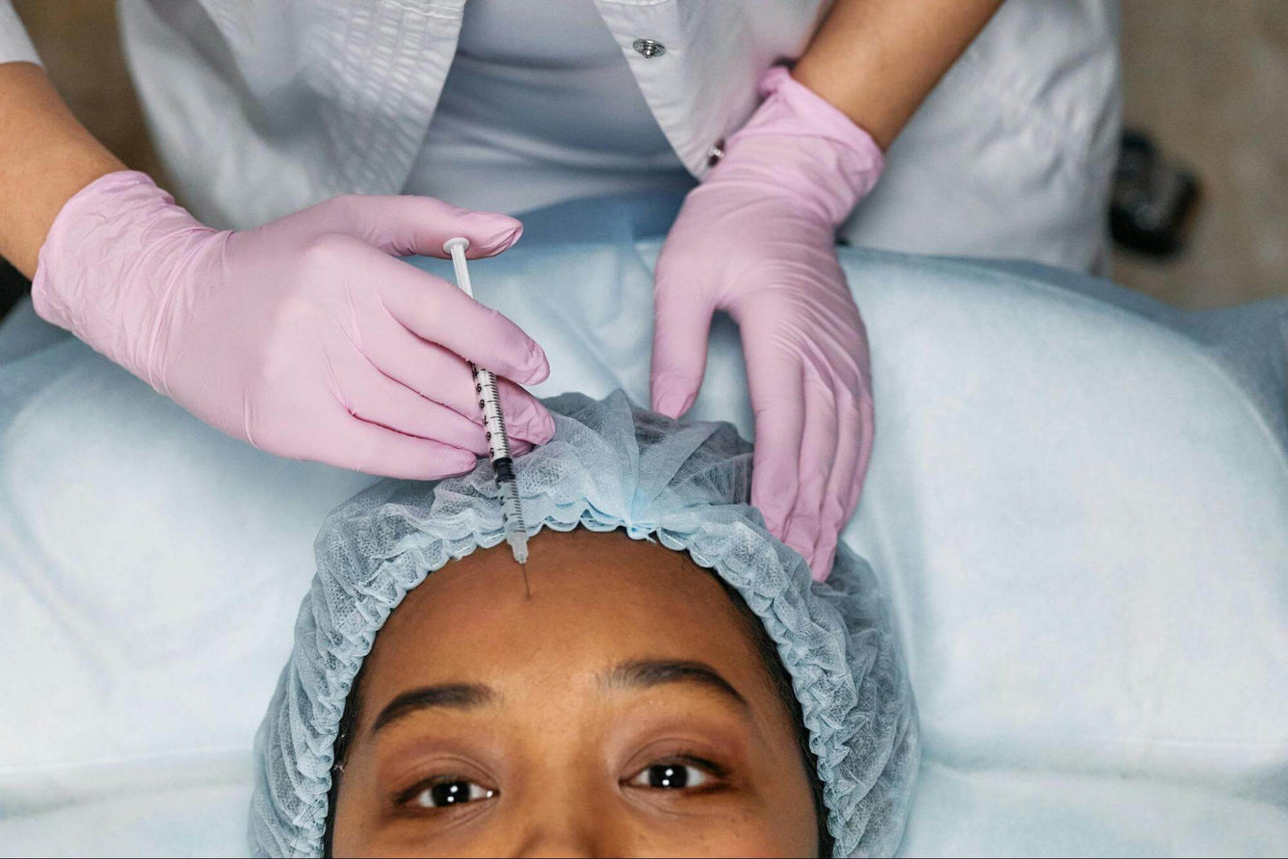 Woman Getting a Botox injection in forehead