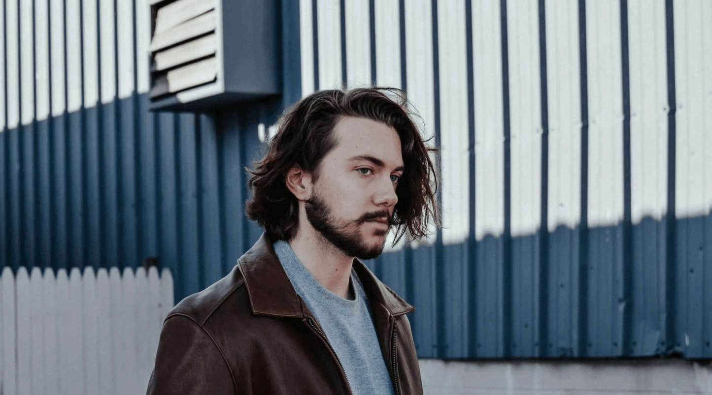 young man with long brown hair